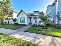 Finished residential front entry with neat beds, lawn edges, and balanced planting