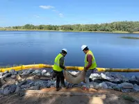 Commercial field crew working on a shoreline landscape stabilization project